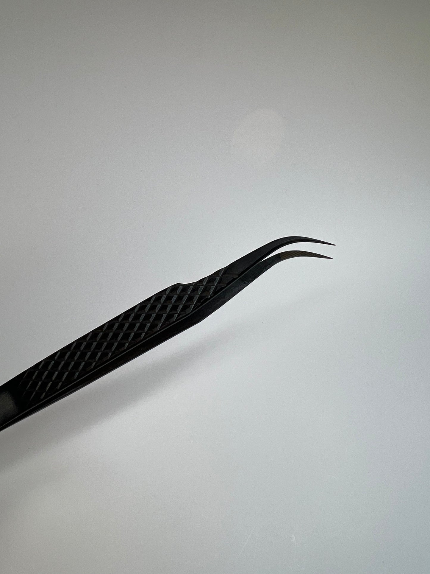 J curve Black fiber tip tweezer